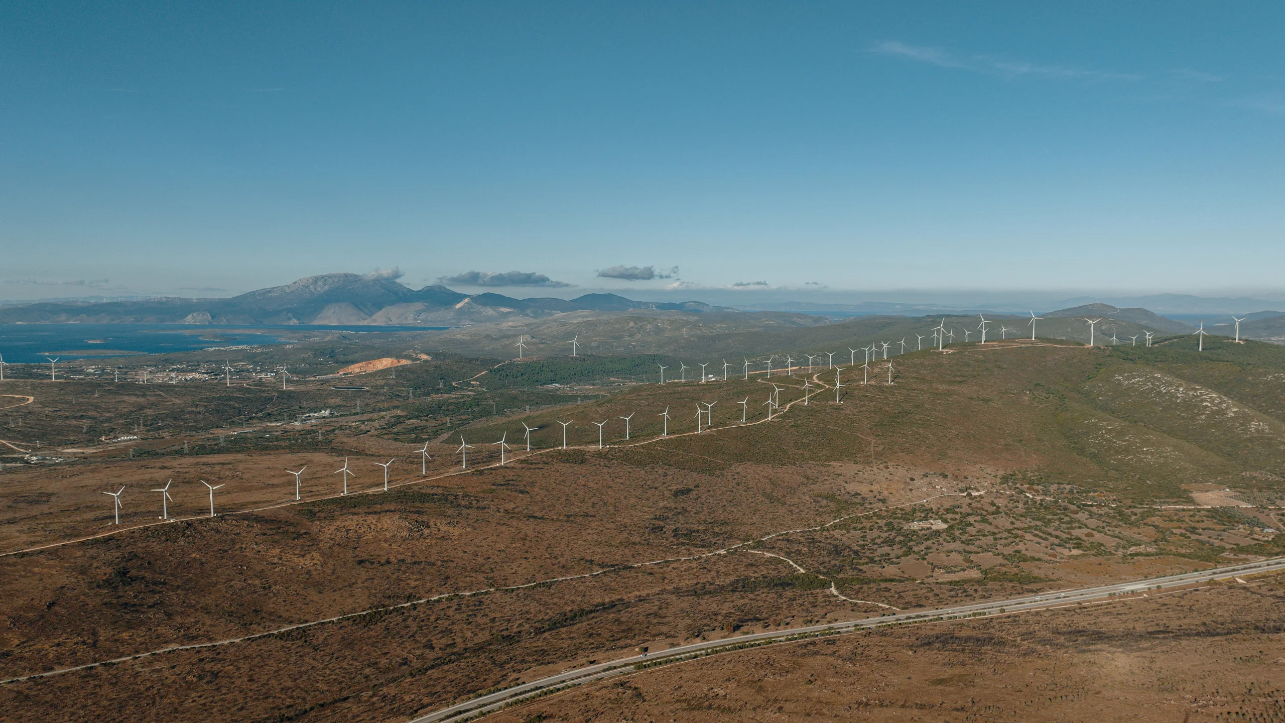 Wind turbines across an open landscape.