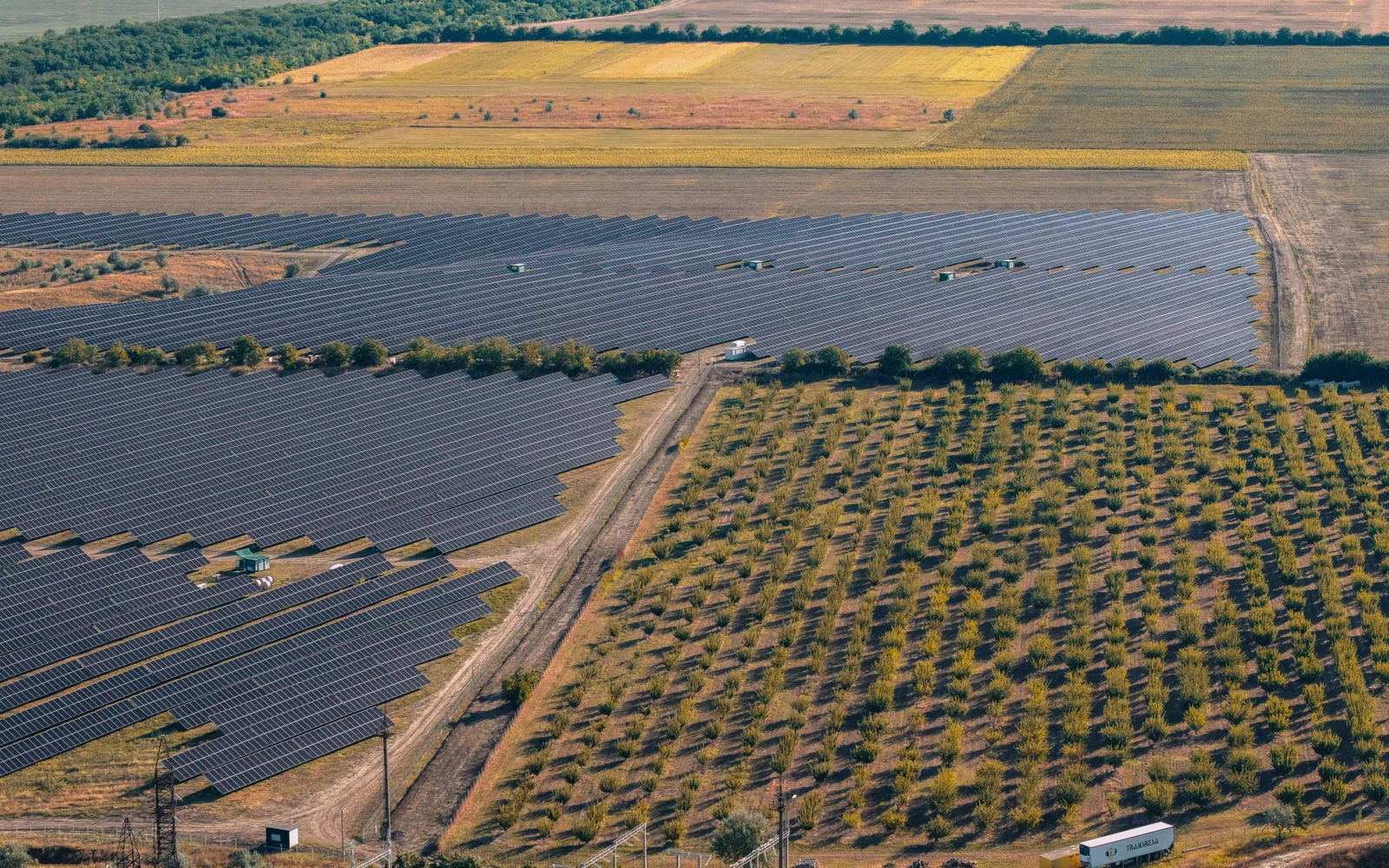A solar field within a broad agricultural landscape.