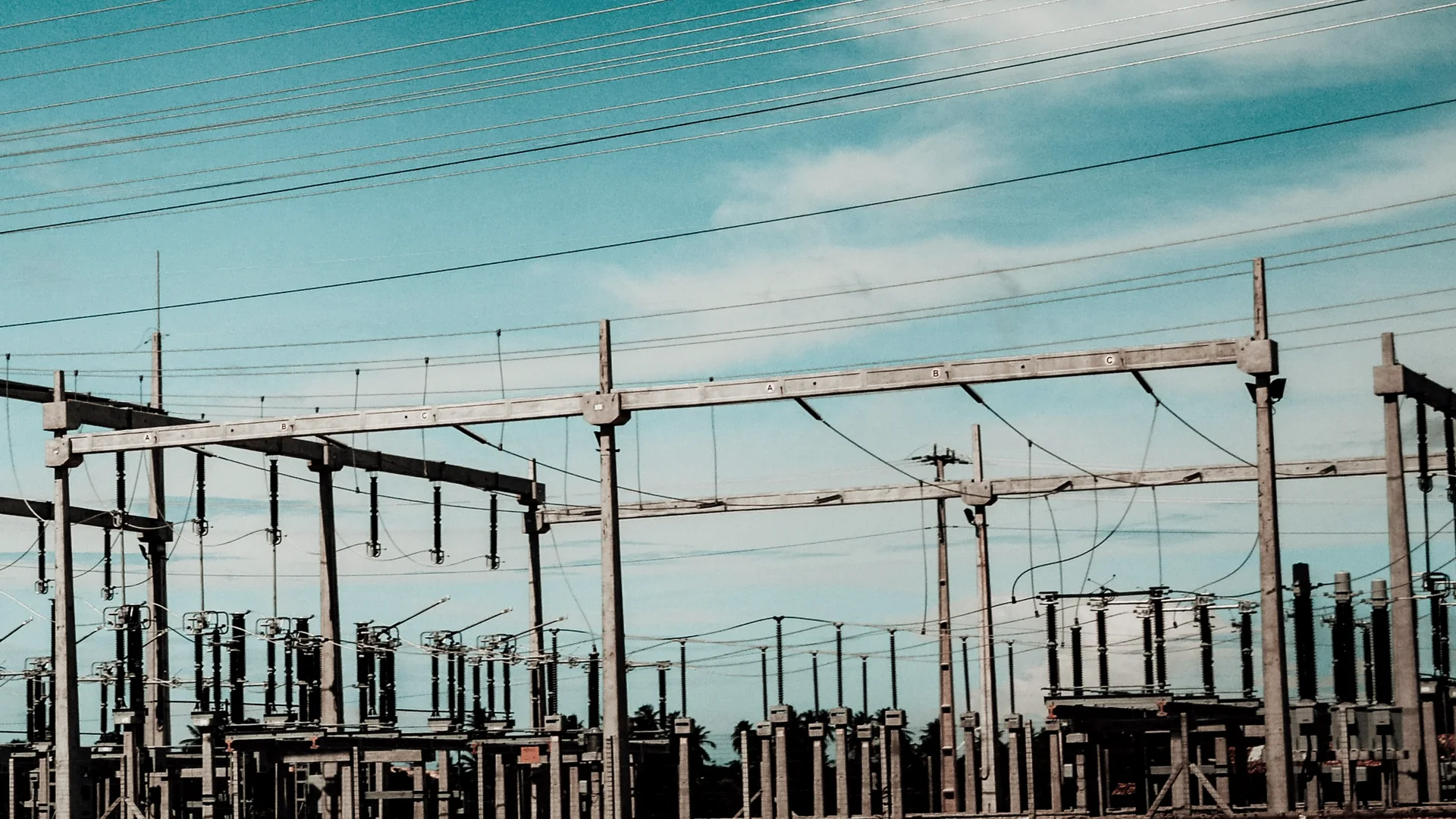 Electrical substation and overhead power lines.