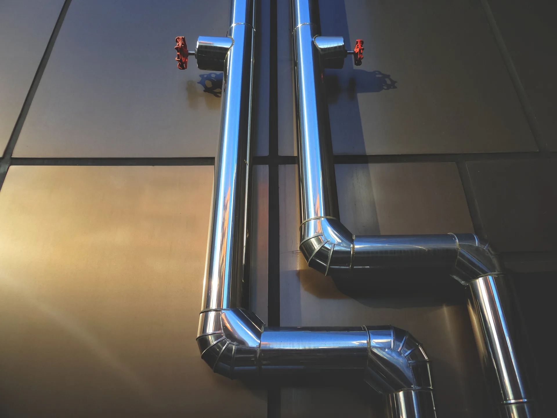 Illustrative photograph of industrial pipes; no hydrogen plant or electrolyser is identified.
